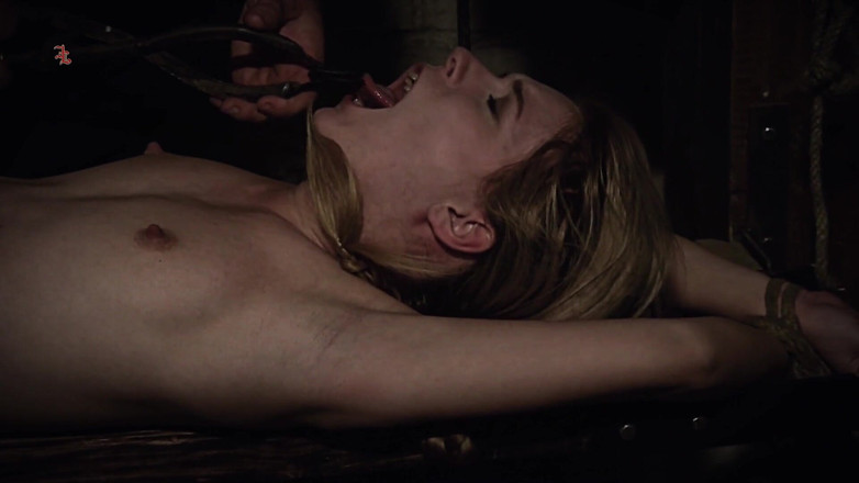 Inquisition and prison world: The Rack - Blonde Maid Alice Tormented on a Hard Wooden...