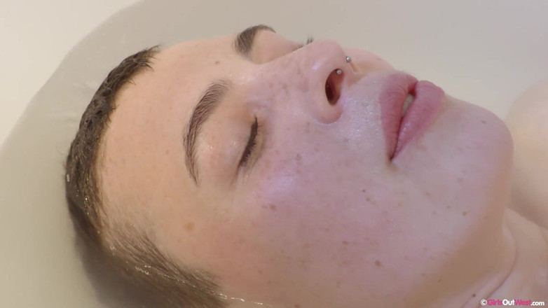 Girls Out West: Busty amateur with hairy pussy masturbates in the bathtub