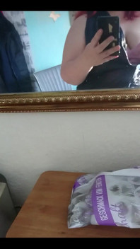 Showing off in a cool lab coat in front of the mirror