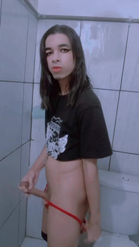 Shemale Slut and Shameless, on Her Knees Sucking Two Cocks at the Same Time