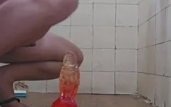 Putting a Huge Dildo in the Ass.