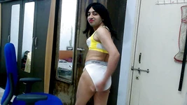 Dirty sissy crossdresser femboy Sweet Lollipop in a sports bra and thong.