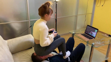 Petite Princesses Femdom: Gamer Kira in leggings uses her chair slave while playing