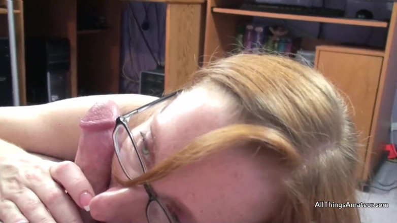 All Things Amateur: Thin redhead in glasses sucking on cock