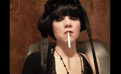 Femdom Austria: Glamorous beauty smoking a cigarette