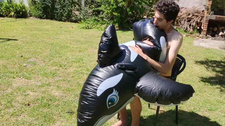 Floatie Boy: Beautiful Man Inflates His Inflatable Whale Near Pool Outside
