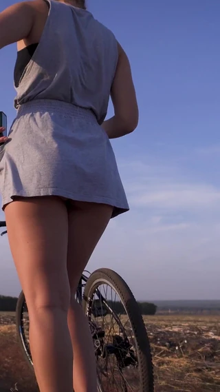 Teasecombo 4K: Cycling Outdoors and Flashing Ass in Miniskirt
