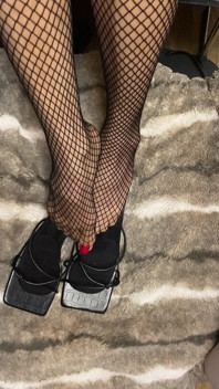 Fishnet in Open Toe Shoes with Red Nail Polish