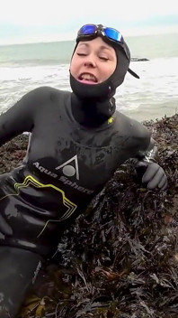 Rubbery Beach Encounter: Lucy's Neoprene Pussy Play with Stranger