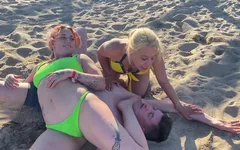 Two Lesbian Hotties Wrestling on the Beach and After That Start Kissing