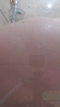 The camera is watching a mature chubby milf in the shower. Gorgeous fat ass, big natural boobs, hairy pussy. PAWG.