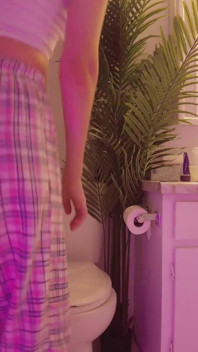 Emily pissing in the bathroom