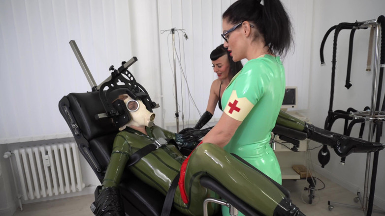 Rubber pervs: 2 Latex Femdoms Give the Slut a Medical Exam