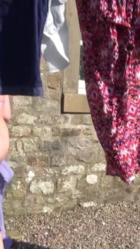 Trisha hanging out the washing