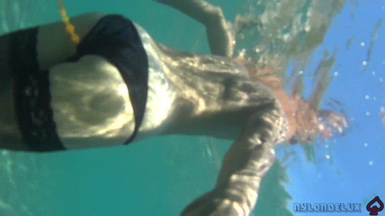 Nylondelux: Black Stocking and Anal Beads in the Sea
