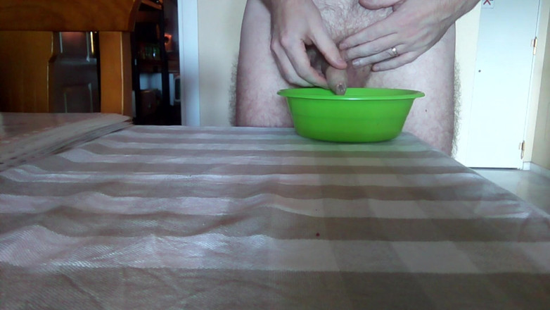 Sex hub male: John is peeing into a green bowl on the table