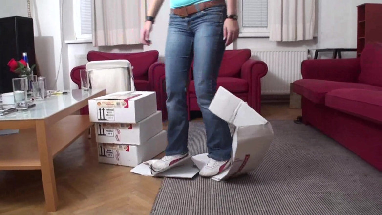 Foot Girls: Trampling boxes in the living room