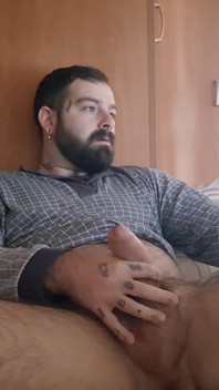 The Bear Masturbates in Bed with His Hairy Body