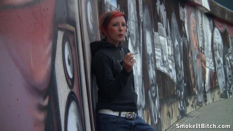 Smoke it bitch: Girl with colored hair &amp; a pierced face smokes a cigar...