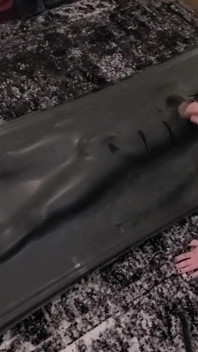 Cute twink tormented in latex vacbed