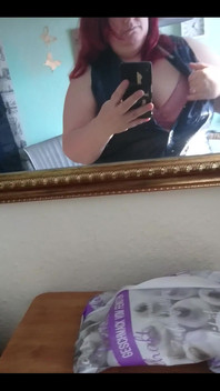 Showing off in a cool lab coat in front of the mirror