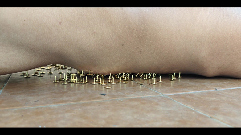 Lily Slav: A Little Masochistic Submissive Lying on Thumbtacks