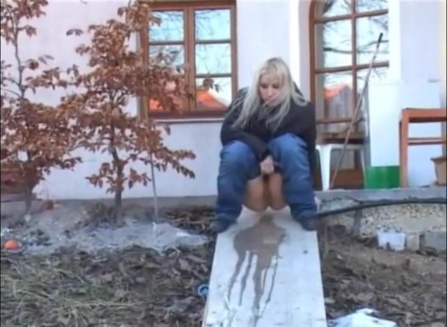 Femdom Austria: Slut pisses next to a house