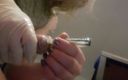 Krystall Cox: Filling a Condom Full of Cum with Sounding Rod Inserted