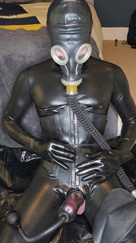 Latex doll training, gasmask, cock pump, plugged