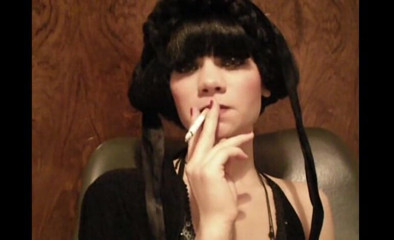 Femdom Austria: Glamorous beauty smoking a cigarette