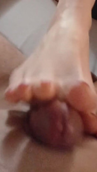 Kelly Performs a Technical Footjob Bringing Dominik's Cock to a Squirting Orgasm.