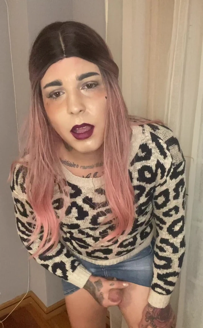 EmmaInkTrans: In a jacket with jaguar print and denim skirt, I...