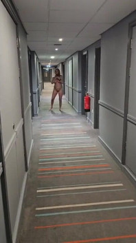 Naked in the Village Hotel Corridor