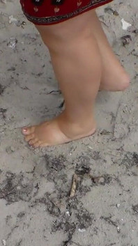 Jen Shows up Her Naked Feet in the Sand