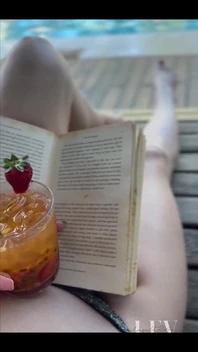 Reading by the Pool in a Bikini That Barely Counts as Spf