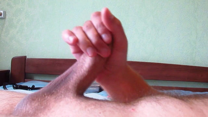 Hot guy solo: Hot gay jerks off his big cock on the bed...