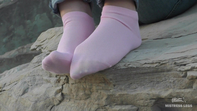 Mistress Legs: Sexy feet in pink ankle socks on the seashore