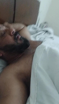 Indian Daddy Lying on the Bed Teasing and Posing for You