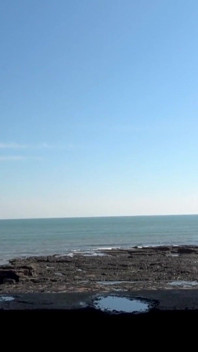 Lifejacket and Jeans on the Beach