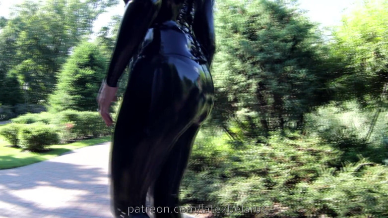 Dominatrix Miss Patricia Stark: Black latex catsuit outdoors