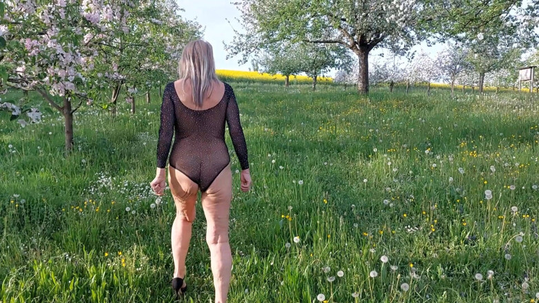 martinawest: Mature Woman Is Walking Around Outside in a See-through Bodysuit!