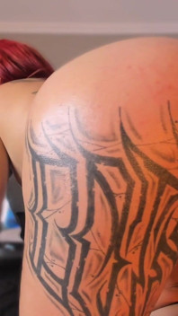 Latina Shakes Her Tattooed Butt