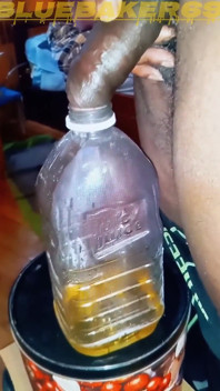 Pissing in a Large Juice Container