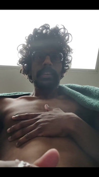 Masturbating