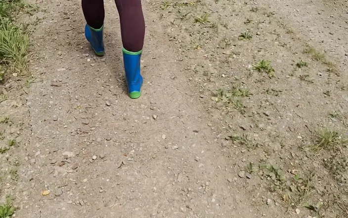 Bouncy Tits Action: Walking in rubber boots