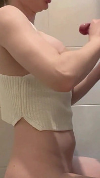 Busty Blonde Sucks Cock in the School Bathroom