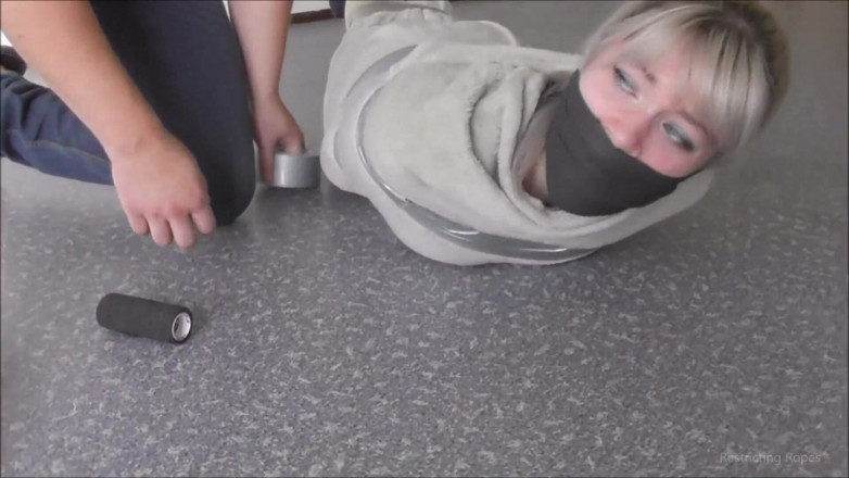 Restricting Ropes: Tied up by her captor on the floor