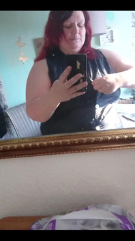 Showing off in a cool lab coat in front of the mirror