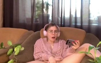 Watching Porn. the Lusty Gameress Decided to Satisfy Her Sweet Pussy with Fingering
