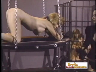 Erotic Lezdom: Brunette domina whips her slave